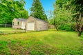 Old small fixer-upper house. Backyard view Royalty Free Stock Photo