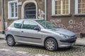 Old small French car Peugeot 106 parked