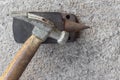 Old small hammer and miniature anvil with concrete background Royalty Free Stock Photo