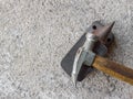 Old small hammer and miniature anvil with concrete background Royalty Free Stock Photo