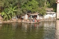 Old Small House On Backwaters and on front Villagers, Mango, Banana trees, Upper Lake, Madhya Pradesh,