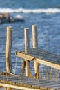 Old small jetty at Swedish coastline during afternoon sun