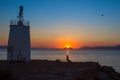 Old small lighthouse of the Aegina island, Saronic gulf, Greece, at sunset