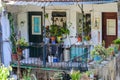 Old small messy balcony with many plants in the historic Affama district in Lisbon, Portugal