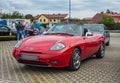 Old small nice Italian sports roadster car Fiat Barchetta parked