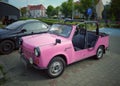 Old small pink plastic East German compact convertible car Trabant 601 1.1 in July, 2022