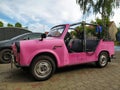 Old small pink plastic East German compact convertible car Trabant 601 1.1 in July, 2022