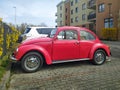 Old vintage classic red car Volkswagen Beetle left side view Royalty Free Stock Photo