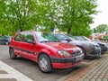 Old small red French compact city car Citroen Saxo parked Royalty Free Stock Photo