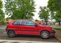 Old small red French compact city car Citroen Saxo parked Royalty Free Stock Photo