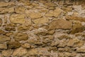 Old small wall made of stone. .The fence is made of sandstone. Royalty Free Stock Photo