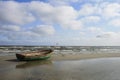 Old small boat lying on the beach Royalty Free Stock Photo