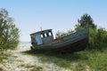 Old small boat lying on the beach Royalty Free Stock Photo