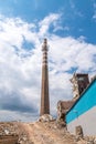 Old smokestack in old factory during demolation