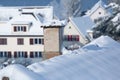 Smoking chimney covered with snow and icicled Royalty Free Stock Photo