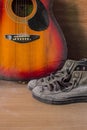 Old sneakers and guitar Royalty Free Stock Photo