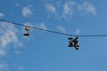 Old sneakers hanging on a wire Royalty Free Stock Photo