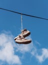 Old sneakers on a wire Royalty Free Stock Photo