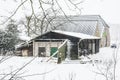 An old snowy barn behind naer a farm in nature reserve kruisbergse Bossen Royalty Free Stock Photo