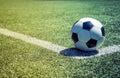 Old soccer ball on the grass Royalty Free Stock Photo