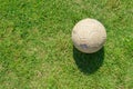 Old soccer ball on green grass of soccer field Royalty Free Stock Photo