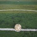 Old soccer ball on new Artificial turf Royalty Free Stock Photo