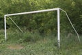 Old soccer football gate on field with green grass Royalty Free Stock Photo