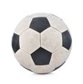 Old soccerball on white background.