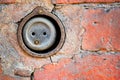 Old socket on the facade of a brick building Royalty Free Stock Photo