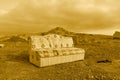 Old sofa abandoned in the middle of the mountains Road trip at the capital of Oman Muscat. Oman village life background. mountain Royalty Free Stock Photo