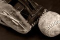 Old Softball with Glove Monochrome on Dark Background Royalty Free Stock Photo