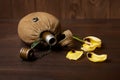 Old soldier`s flask and St. George`s ribbon on wooden background, yellow flower, world war II memorial concept and fallen warrio Royalty Free Stock Photo