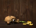 Old soldier`s flask and St. George`s ribbon on wooden background, yellow flower, world war II memorial concept and fallen warrio