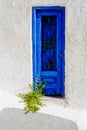 The old and solid painted wooden doors are one of the charms of the magnificent Cyclades islands, in the heart of the Aegean Sea