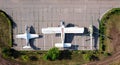 Old soviet aircraft and helicopter parked on exhibition area in open air museum. Drone view photo. Abandoned military