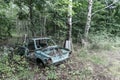 Old Soviet car. Broken car in the woods Royalty Free Stock Photo