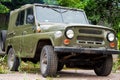 An old Soviet car, a green SUV for hunting
