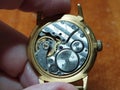 Old soviet gold wrist watch in hand close-up Royalty Free Stock Photo