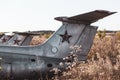 Old soviet L-29 plane fuselage empennage in field