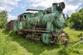 Old Soviet locomotive stands on narrow-gauge railway. Old Village museum, Kolochava, Ukraine