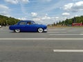 Old Soviet retro car GAZ-21 drive on street during retro-cruise