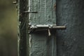 Old  rusty iron retro latch on a painted wooden door Royalty Free Stock Photo