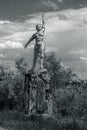 The old Soviet sculpture Worker and Collective Farm on road offers entry into a dying Ukrainian village. Old Soviet monument,