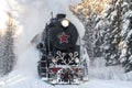 Old Soviet steam locomotive L-5031 close-up in motion in a winter forest