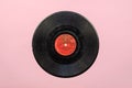 Old Soviet vinyl record from the 50`s on pink Royalty Free Stock Photo