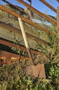 Old spade leans on a cattle loading chute Royalty Free Stock Photo