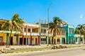 Old Spanish colonial houses with palms along the street in the c