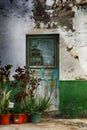 Old Spanish weathered front door and garden