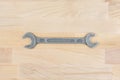 Old spanner on a wooden table Royalty Free Stock Photo