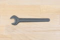 Old spanner on a wooden table Royalty Free Stock Photo